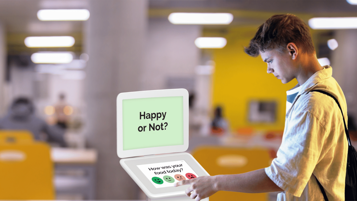 Teenage-student-giving-feedback-with-Smiley-Touch-1366x768